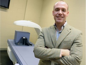 Darren Candow, a researcher who is studying bone density in women over 50 shown beside a x-ray machine in Regina, SK on March 19, 2015.