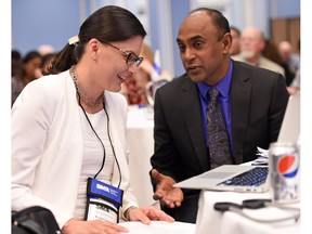 Dr. Janet Tootoosis chats with incoming president Dr. Intheran Pillay at the Saskatchewan Medical Association's Spring Representative Assembly in Regina.