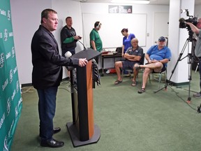There was typically a distance when Chris Jones, left, met the media during his time with the Saskatchewan Roughriders.
