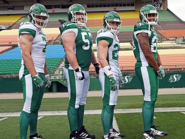 (L-R) Justin Capicciotti, Brendon Labatte, Matt Webster and Spencer Moore at the launch of the new Saskatchewan Roughriders adidas uniforms for the 2016 season. The black trim was removed from the jersey and the numbers and the pants feature four stripes on the left side – each one representing a Grey Cup victory over the years.