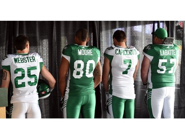 (L-R) Matt Webster, Spencer Moore, Justin Capicciotti and Brendon Labatt at the launch of the new Saskatchewan Roughriders adidas uniforms for the 2016 season. The black trim was removed from the jersey and the numbers and the pants feature four stripes on the left side – each one representing a Grey Cup victory over the years.