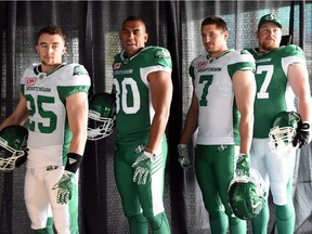 Saskatchewan Roughriders players (left to right) Matt Webster, Spencer Moore, Justin Capicciotti and Brendon LaBatte model the team's new uniforms on Thursday.