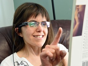 With a point of her finger, Jessica Bonish's OrCam will take a picture of text, which will be read to her by a microphone on her glasses.