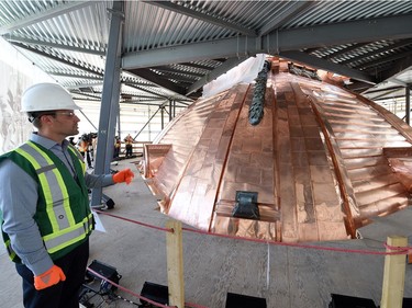 Michael Toews, project manager with the Government of Saskatchewan's central services, looking over garland that was refurbished and reinstalled on the Saskatchewan Legislature Dome during the renewal  project.  The project has used 12,700 kilograms of copper, worth $100,000 while the entire restoration project cost is approximately $21 million.