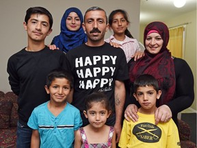REGINA SK: MAY 17, 2016 – Syrian refugee's Mostafa Eljasouma (C) surrounded by his family (clockwise) Ghouroub, Mohamad, Mahmoud, Fatima, Khadija, Rabea'a Elghawi and Moataz.  Lisa Ashton has started an online fundraising campaign for Mostafa, a Syrian refugee who has to get all of his teeth removed and needs dentures. The teeth removal is covered by the government but the dentures are not.  DON HEALY