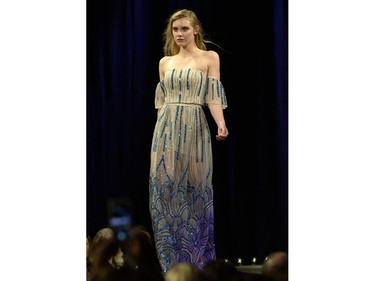 A model wears a design by Beryl Wong of Regina on the runway on the opening night of Saskatchewan Fashion Week at Canada Saskatchewan Production Studios in Regina.