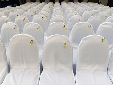 Empty chairs sit representing 122 long-term missing persons cases at a news conference for Missing Person Week.