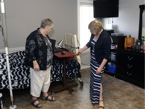 REGINA,Sk: May 24, 2016 --Lynne Demeule, Cheshire Homes Society of Regina board chair, shows a room to Lucy Mazden, executive director of Chip and Dale Homes, at the opening of the new Cheshire Homes Society of Regina group home.  BRYAN SCHLOSSER