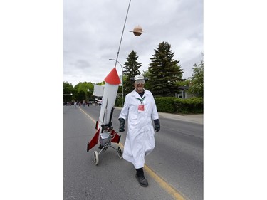 Richard Gustin of the Cathedral Art Kart Anarchists pulls a space-themed cart in the kick-off parade of the Cathedral Village Arts Festival in Regina, Sask. on Monday May. 23, 2016.