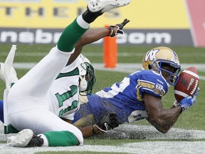 Clarence Denmark, shown catching a touchdown pass for the Winnipeg Blue Bombers against the Saskatchewan Roughriders in 2013, is a new addition to the Green and White.