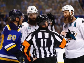 Brent Burns (middle) and Joe Thornton (right) of the San Jose Sharks debate a call with Alexander Steen of the St. Louis Blues (left) and referee Kelly Sutherland during Game 5 of the Western Conference final Monday. The Sharks — and their beards — will meet the Pittsburgh Penguins in the Stanley Cup final.