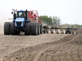 A farmer seeds his crop near Strasbourg; provincewide, cropland topsoil moisture is rated as six per cent surplus and 77 per cent adequate.