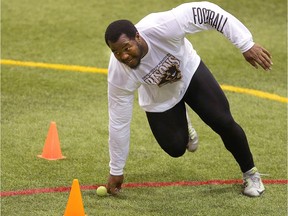 University of Manitoba Bisons defensive tackle David Onyemata, shown running a drill for NFL scouts in Winnipeg in March, is the best player available in the May 10 CFL draft in the opinion of columnist Mike Abou-Mechrek.