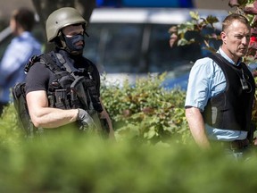 VIERNHEIM, GERMANY - JUNE 23: Heavily-armed police stand outside the movie theatre Kinopolis where an armed man has reportedly opened fire on June 23, 2016 in Viernheim, Germany. According to initial media reports, the man entered the cinema today at approximately 3pm, fired a shot in the air and barricaded himself inside.