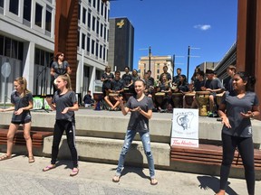 A high school group performs in City Square Plaza in Regina for World Refugee Day on June 20, 2016.