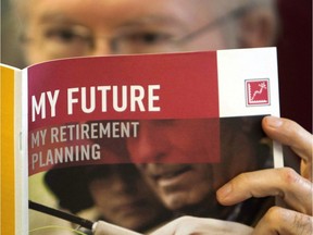 A man looks over a brochure offering various retirement savings options.