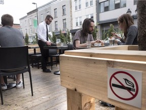 A no-smoking sign on a patio in Montreal. Quebec's anti-smoking law kicked in last month, prohibiting smoking on outdoor patios.