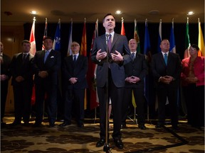 Federal Finance Minister Bill Morneau and his provincial counterparts end a meeting with a surprisingly smooth tentative agreement on overhauling the Canada Pension Plan. Saskatchewan's Kevin Doherty is at the rear, second from the right.