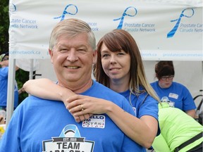 Carmen Hanoski, right, stands with her father Stan at a fundraising walk at Wascana Centre in Regina, Sask. on Sunday June. 19, 2016. After learning there was no Do It for Dads walk in Regina this year, Hanoski took it upon herself to organize her own fundraiser in honour of Stan, a prostate cancer survivor.