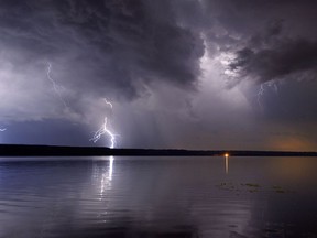 A lightning strike (not as pictured) set three oil tanks in southeastern Saskatchewan on fire.