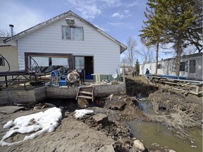 Lakefront home battered by flood waters in 2013.