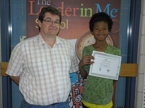 Tony Ruhland of Muskowekwan School with his pupil Evelyn Checkinew, who took national mathematics honours in the National Wiseman Mathematics Contest organized by the First Nations University of Canada.