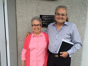 Norma Welsh stands with CEO of Gabriel Housing Corp. Doug Moran in front of the building that was named in her honour. (Photo supplied by Doug Moran)