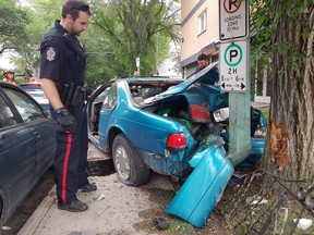Regina police at the scene of a single-vehicle crash at St. John Street near Victoria Avenue on the morning of June. 9, 2016.