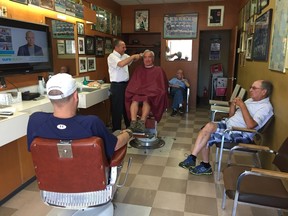 Pat Grandy gets his last haircut from Giovanni Palamara on Friday, June 24 at the Italian Barber Shop. The business has been open for more than 50 years and on Friday it closed for good when Palamara retired.