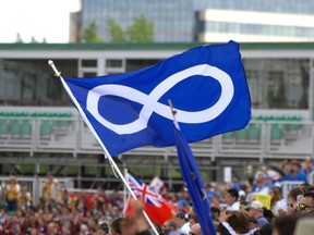 REGINA, SASK - July 20, 2014  -  A Metis flag flies during the opening ceremonies at the North American Indigenous Games held at Mosaic Stadium in Regina, Sask. on Sunday July 20, 2014. (Michael Bell/Regina Leader-Post)