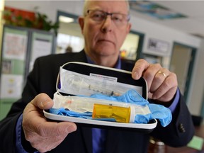 Paul Hodson, nurse consultant for addiction services, holds up a take-home naloxone kit in Regina on July 29. Kits will become available in Regina through RQHR's Harm Reduction Methadone Program beginning on July 4. TROY FLEECE / Regina Leader-Post