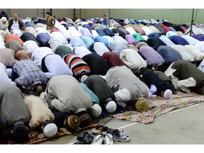 Muslims pray at Evraz Place at the end of Ramadan in 2013