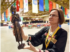 Kyiv Ukrainian Pavilion ambassador Oksanna Zwarych displays a smaller version of the Holodomor statue erected near the Saskatchewan Legislative Building in Regina. This smaller version is on display at the Kyiv Ukrainian Pavilion. Zwarych and her team are busy at work setting up the showcase ahead of this weekend's Mosaic festival.