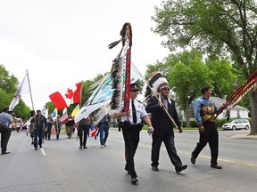 REGINA SK: JUNE 02, 2016 – From left, Deputy police chief Dean Rae, Chief Myke Agecoutay from the Muscowpetung Saulteaux First Nation, FSIN Chief Bobby Cameron during the annual smudge walk through north central Regina. DON HEALY / Regina Leader-Post