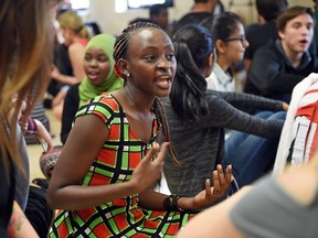 Jannet Mbabazi and other students dialogue during Let's Talk Culture at Sheldon-Williams Collegiate on Thursday.