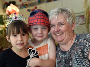 Mary Ann McGrath, executive director of the Regina Early Learning Centre, with students Khloe Taypotat (L) and Felix Modich (R). The child and family development centre works with low-income families to foster and help development of children from prenatal to five years of age.