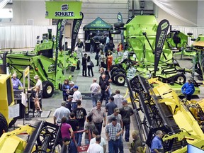 Farmers check out equipment at Canada's Farm Progress Show in Regina in mid-June. Farm equipment sales are expected to improve this year and next after a tough year in 2015, Farm Credit Canada says in a new report.