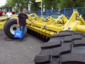 Len Glenn from Rocanville looks over a Pro-till 40 from Degelman Industries Ltd., at the Farm Progress Show this week. Degelman Industries Ltd., located here in Regina has launched innovative agriculture products recently, including the Straw Master Pro, which was launched last year.