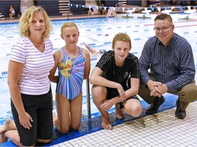 REGINA SK: JUNE 28, 2016 –  From left, The Dickinson family -- Julia , Jada 10 years, Aden 14 years and Anthony, on the pool deck at the Lawson Aquatic Centre. Jada, a member of the Regina Optimist Dolphins, is a cancer survivor who returned to competitive swimming this year. DON HEALY / Regina Leader-Post