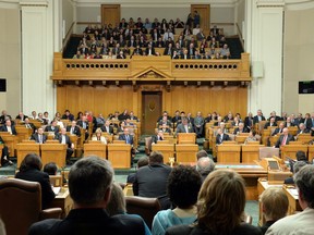 Guests watch proceedings in the Saskatchewan legislature in 2014. It's been suggested the government could save money by reducing the number of MLAs.