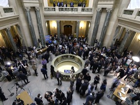 Politicians and guests mingle in the Saskatchewan legislature rotunda on budget day, June 1.