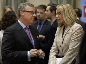 Marilyn Braun-Pollon of the Canadian Federation of Independent Business speaking with Premier Brad Wall in the Legislative Building rotunda following release of the budget Wednesday.