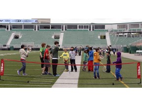 Students try out different activities as part of the Saskatchewan Sports Hall of Fame School Program. During the five weeks of the program, students from the public and Catholic school divisions learned about the history of the stadium and participated in on-field activities such as Tennis  and Rugby.