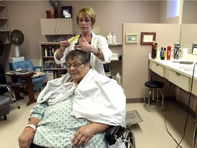 Susan Read cuts Glenys Cole's hair at the Pasqua Hospital hair salon. The Pasqua Hospital Auxiliary has operated Hair Care for 28 years, but the salon is losing money because the number of patients has dropped so auxiliary members voted to close the establishment at the end of July.
