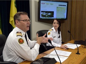 Duane McKay, executive director of emergency management and fire safety, and deputy commissioner Mieka Cleary launch the new SaskAlert mobile app for emergency warnings.