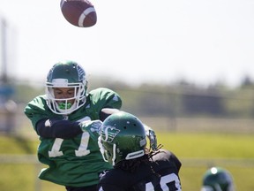 It was plays like this knockdown of a pass attempt by Phillip Sims that earned Jordan Reaves (77) Murray's Monster on Monday at the Riders' training camp.