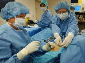 Surgeons perform a knee procedure at a private clinic in Vancouver.