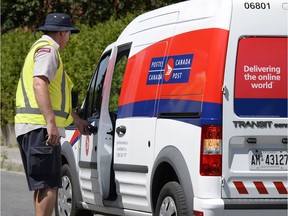 A postal worker works as an ongoing labour dispute between the Canadian Union of Postal Workers and Canada Post continued Tuesday. The Crown corporation  has issued 72-hour lockout notice, which could mean a disruption in postal service could happen as early as Friday.