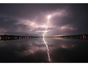 A strike of lightning hit overtop the south side of Katepwa Lake on Tuesday night. Photo courtesy of Tom Brittner.