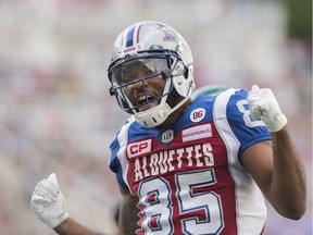 Montreal Alouettes' B.J. Cunningham celebrates a first-quarter touchdown against the Saskatchewan Roughriders on Friday.